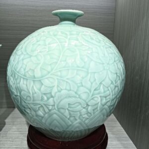 Handmade ceramic vase, green glaze, relief, ornaments